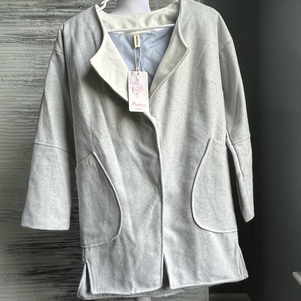 Cute soft gray fleece-like jacket.